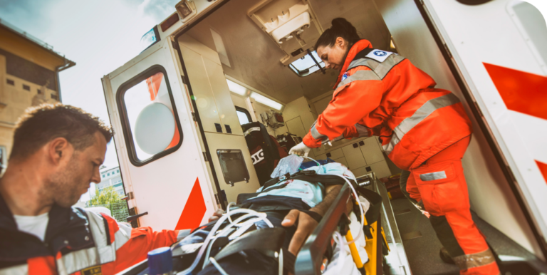emts putting patient into ambulance