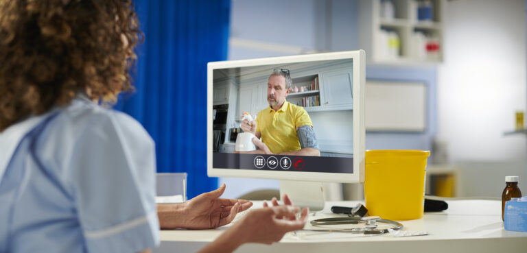 doctor on remote call with patient checking blood pressure