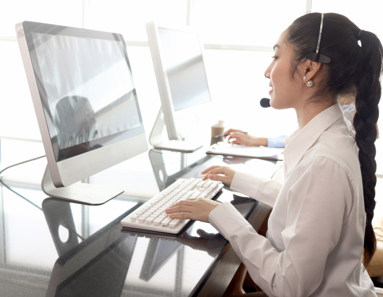 person in call center at computer