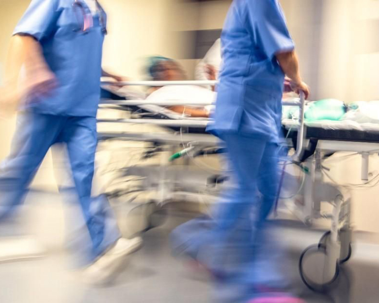 patient on stretcher being transferred