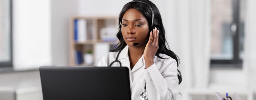 Black doctor on the phone with a patient