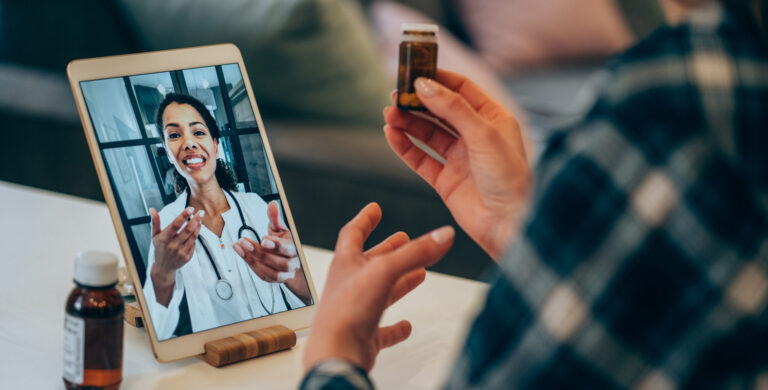 Young woman video chats with doctor.