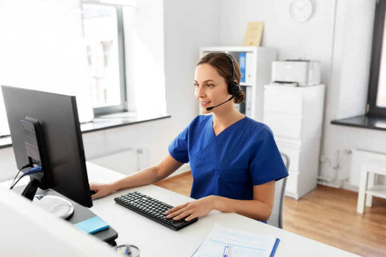 doctor with headset and computer at hospital