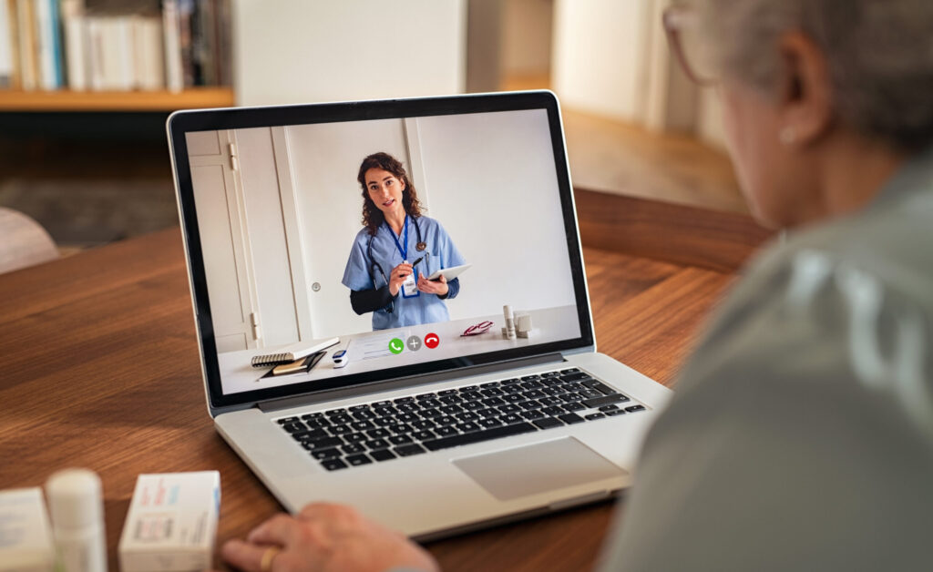 Senior woman in video tele medicine call with doctor