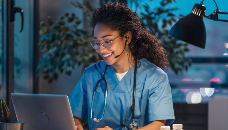 female doctor talking while explaining medical treatment to patient through a video call with laptop in the consultation.