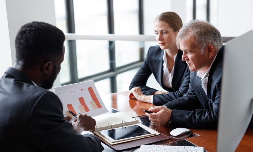 Senior Financial Analyst Presenting A Graph