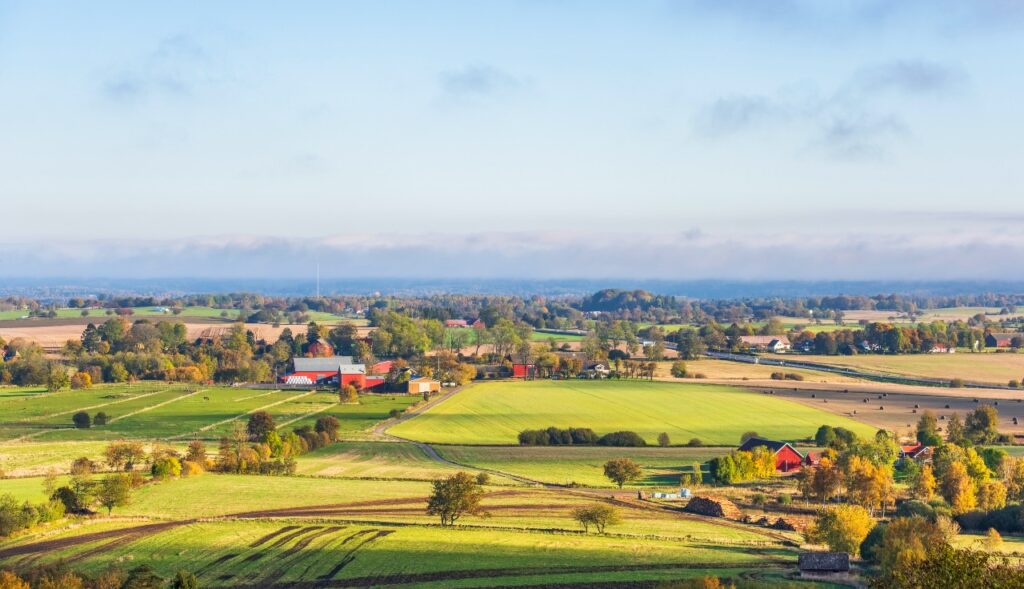 Beautiful countryside landscape view with farms and fields in autumn colours