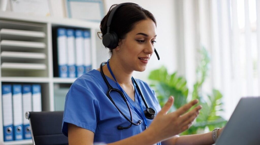 Female Nurse Consulting Patient Online Through Video Call