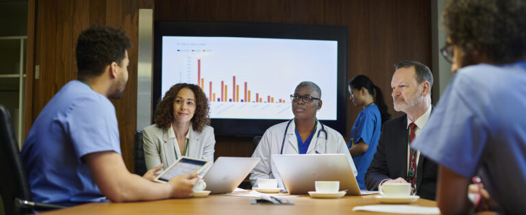 Healthcare, meeting and teamwork with a doctor and her team planning for growth, research and innovation in the medical industry